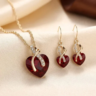 Parure de bijoux cœur torsadé en or et rubis