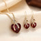 Parure de bijoux cœur torsadé en or et rubis