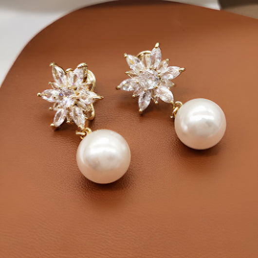 Boucles d'oreilles fleur lumineuse et perle