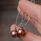 Boucles d'oreilles pendantes en perles plaquées bronze sur argent