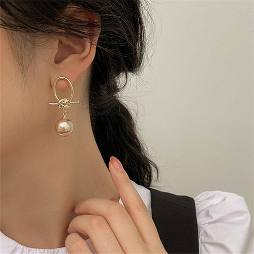 Boucles d'oreilles créoles perle en or