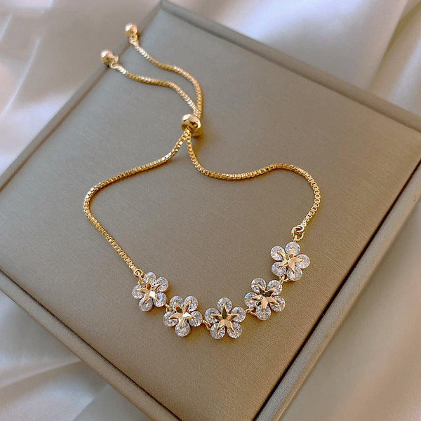 Bracelet marguerite en cristal doré