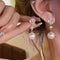Boucles d'oreilles pendantes élégantes en perle