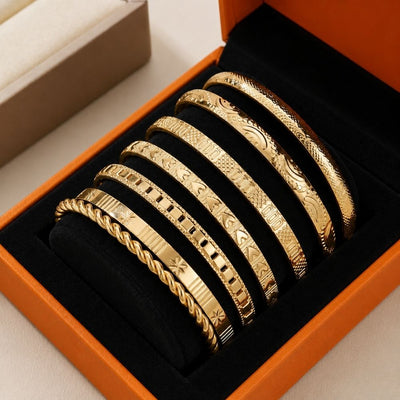 Ensemble de bracelets joncs ouverts dorés Resort