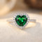 Bague halo cœur en émeraude et argent