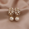 Élégantes et belles boucles d'oreilles en perles