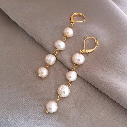 Boucles d'oreilles pendantes en perles dorées